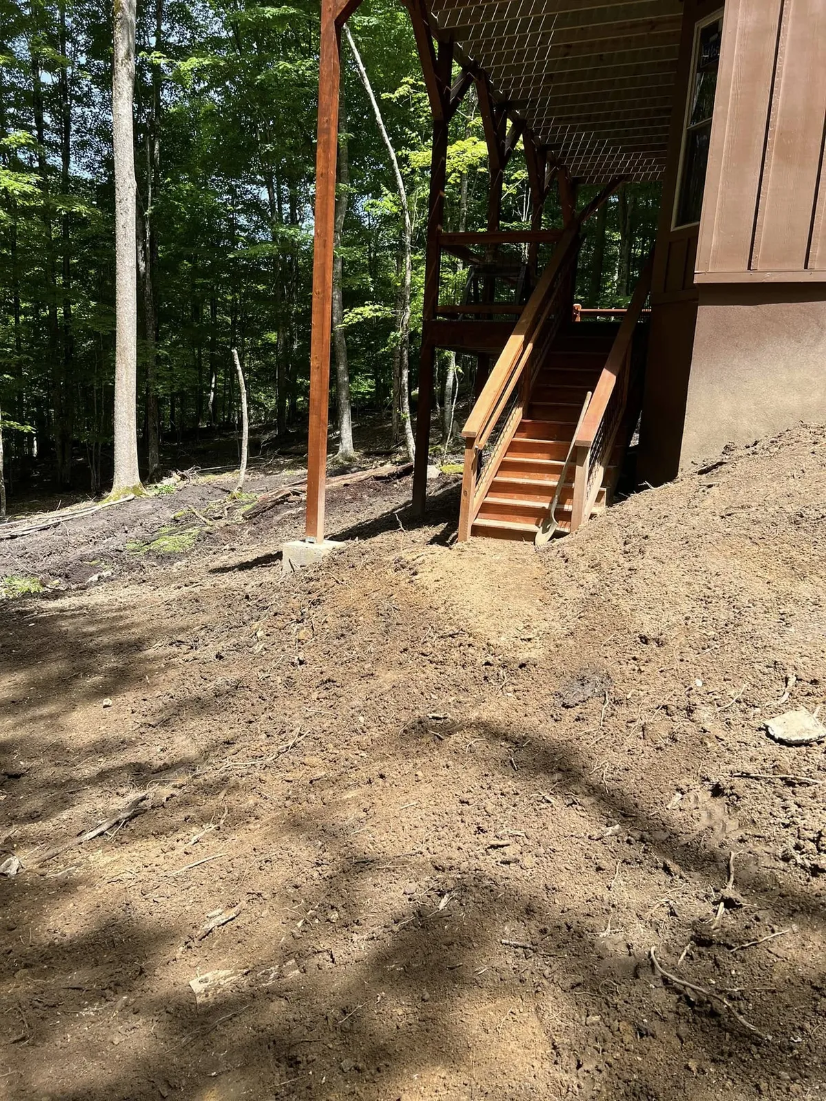 Final-graded slope and access to the deck stairs